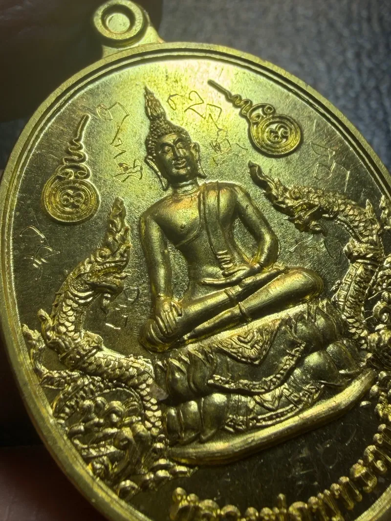 Ajarn Toi · Luang Pho Phuttharit Twin-Naga Buddha Medal · Temple-Building Batch · Hand-Inscribed · No. 16 · Solid Gold · Khon Kaen B.E. 2555 — Certified No. 00481 3
